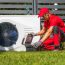 Professional Heat Pumps Technician Installing New Device